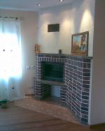 Corner style fireplace with  a capsule - 2007
